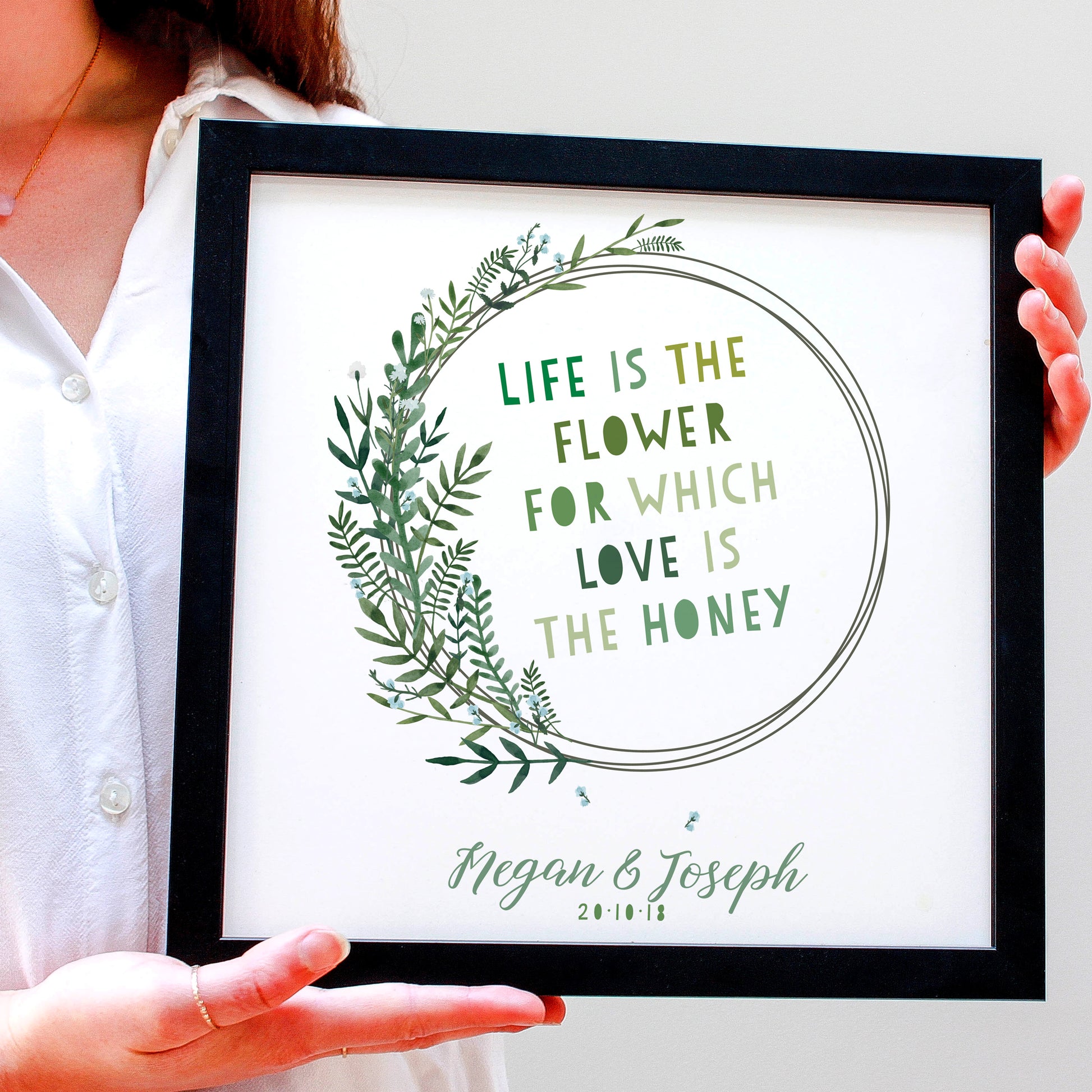 First Anniversary Gift with flowers and a quote framed in a black frame