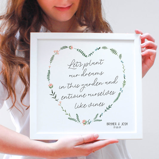 engagement floral framed print, flowers in a heart shape in a white frame