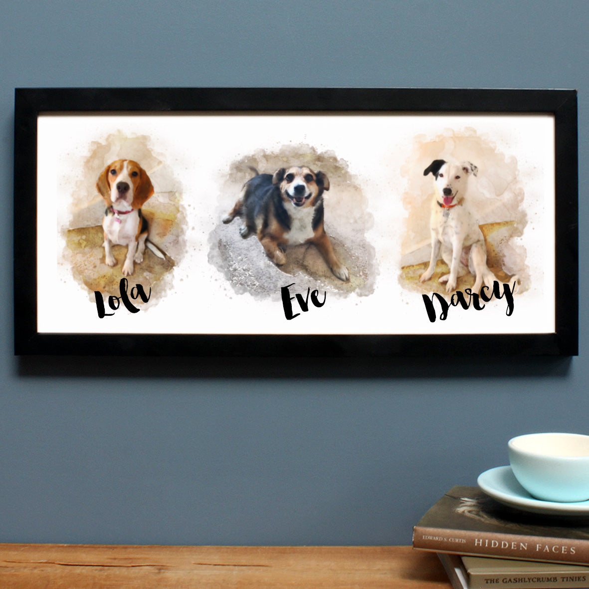 black frame with three dog watercolour drawings
