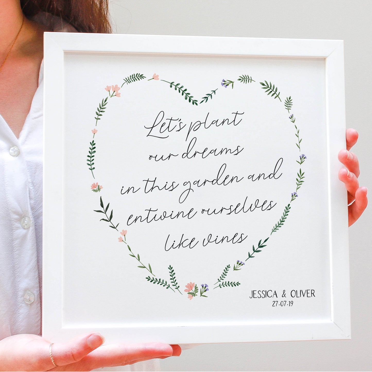 engagement flowery heart for a newly engaged couple with names and a date in a white frame