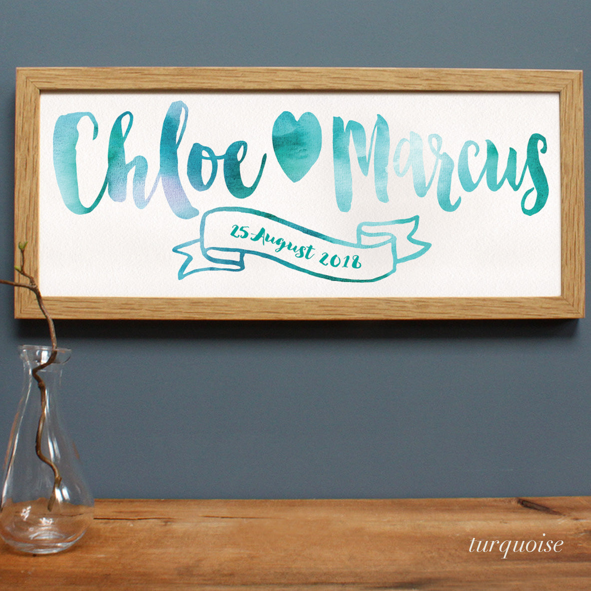 turquoise loose style lettering fro a wedding couple in an oak frame