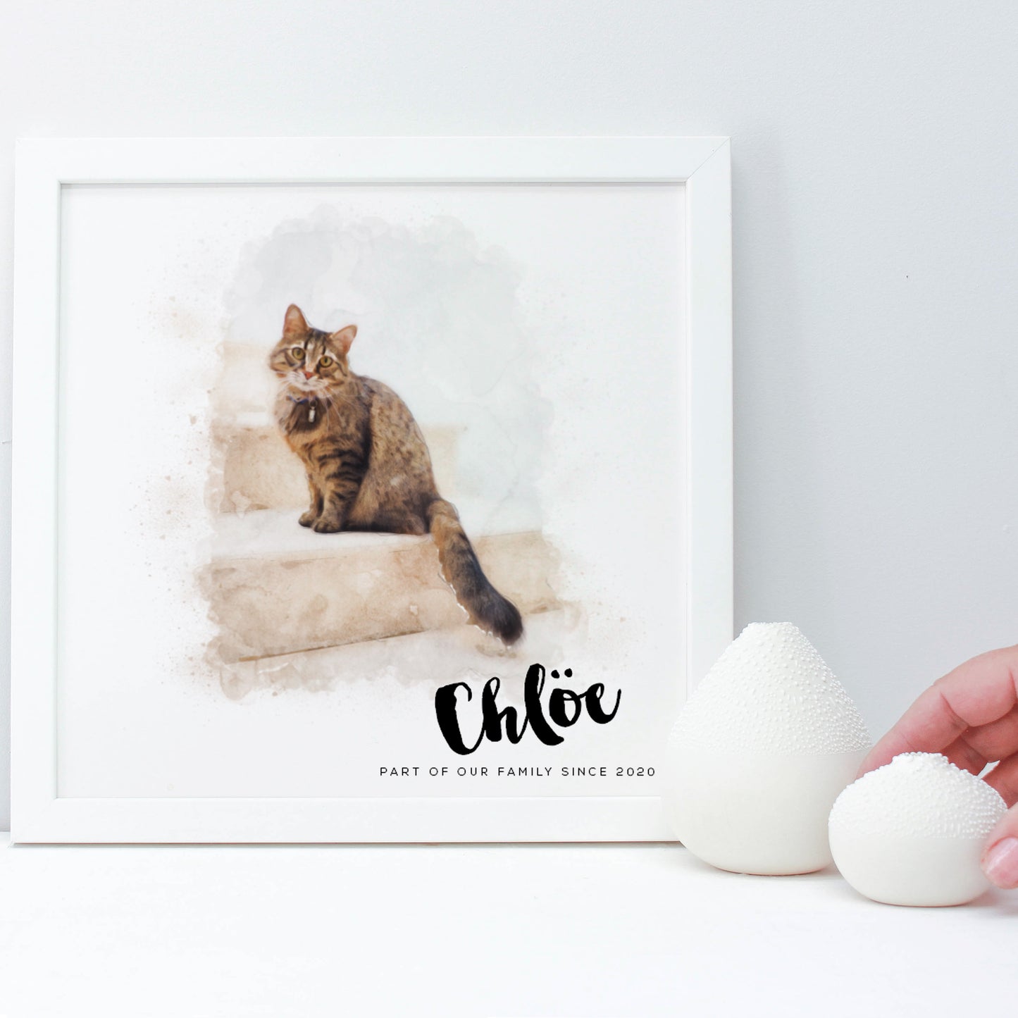 drawing of tabby cat on stairs in a white square frame