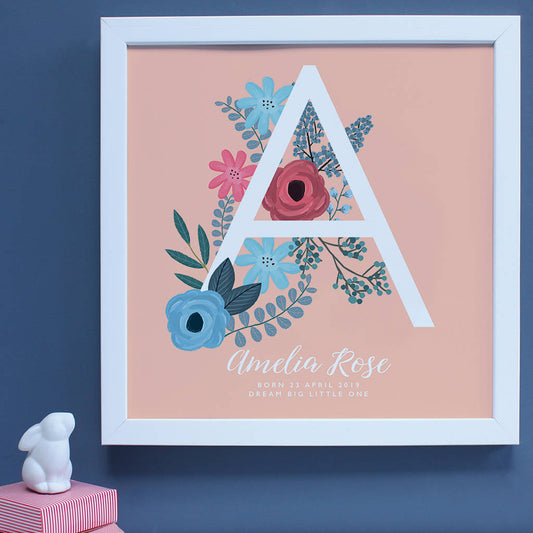 personalised New Baby framed print, large A with floral decoration in a white frame 